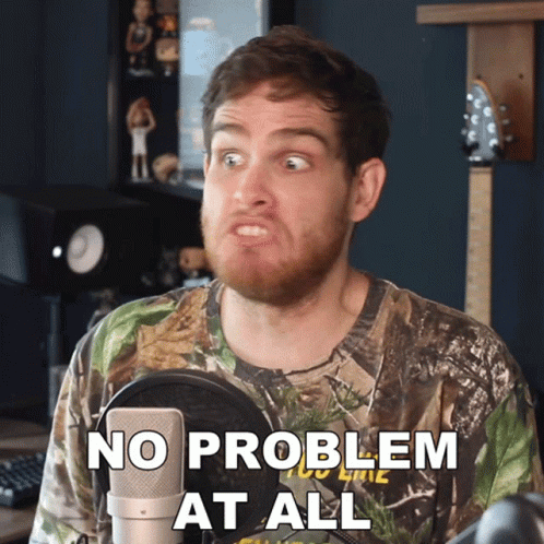 A Man In A Camo Shirt Says No Problem At All In Front Of A Microphone GIF