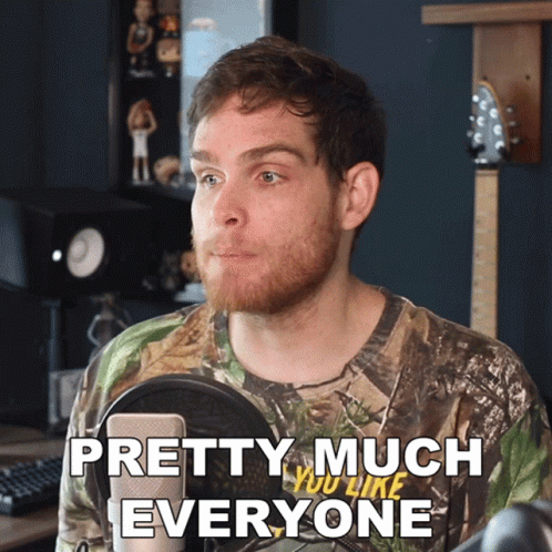 A Man In A Camo Shirt Says " Pretty Much Everyone " In Front Of A Microphone GIF