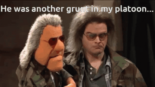A Man In A Camouflage Jacket Is Talking To A Puppet GIF