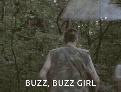 A Man In A Camouflage Shirt Is Running Through A Forest With A Smoke Bomb Coming Out Of His Head . GIF