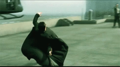 A Man In A Cape Is Flying Through The Air GIF