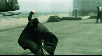 A Man In A Cape Is Flying Through The Air GIF