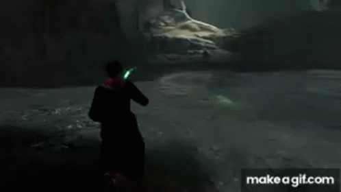A Man In A Cape Is Holding A Green Light In His Hand . GIF