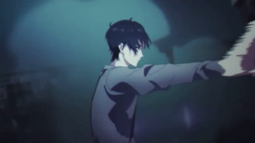A Man In A Cape Is Standing In A Dark Room With A Hand On His Head . GIF