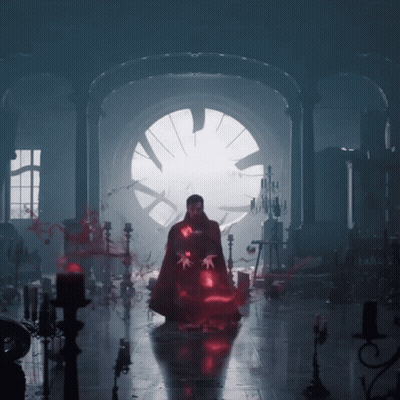 A Man In A Cape Is Standing In A Dark Room With Candles GIF