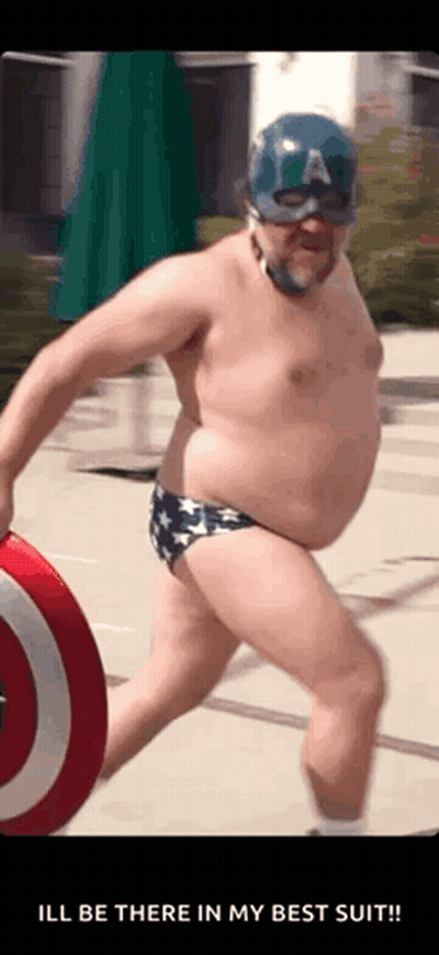 A Man In A Captain America Costume Is Holding A Shield GIF