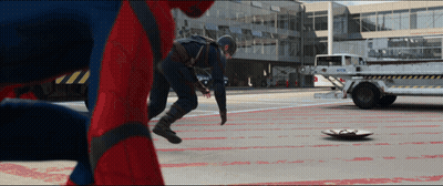 A Man In A Captain America Costume Is Standing Next To A Spider Man GIF