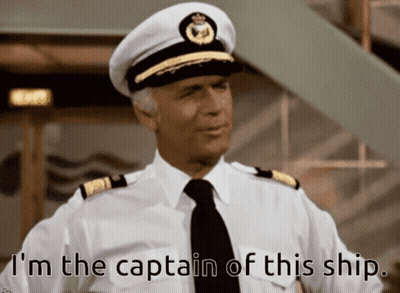 A Man In A Captain 'S Hat And Tie Says I 'M The Captain Of This Ship GIF