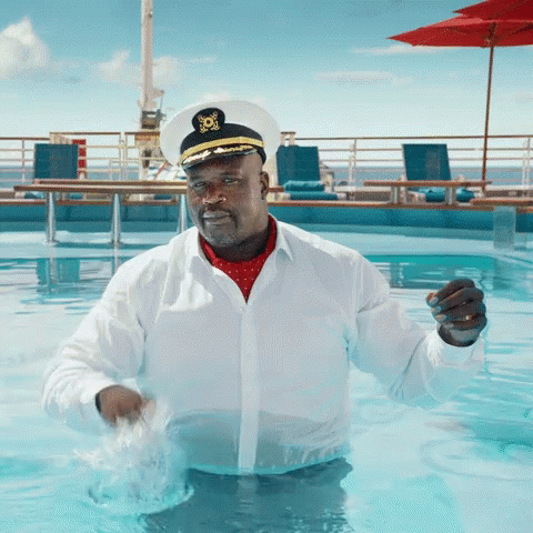 A Man In A Captain 'S Hat Is In A Swimming Pool GIF