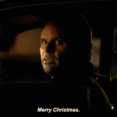 A Man In A Car Says Merry Christmas On The Screen GIF