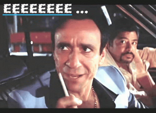 A Man In A Car Talking On A Cell Phone With The Words Eeeeeeee On The Top GIF