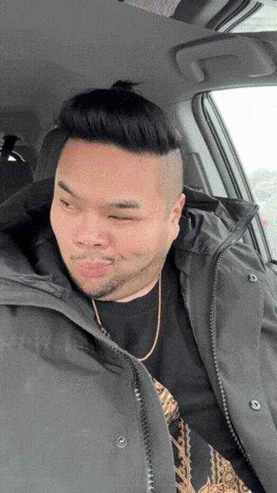 A Man In A Car With His Eyes Closed Wearing A Black Jacket GIF