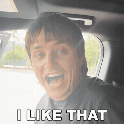 A Man In A Car With His Mouth Open And The Words I Like That Below Him GIF
