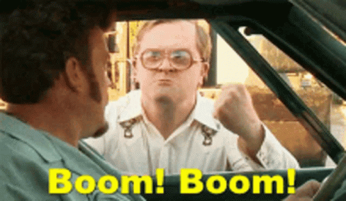 A Man In A Car With The Words Boom Boom On The Bottom GIF