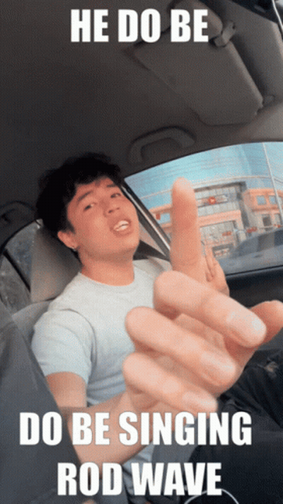 A Man In A Car With The Words He Do Be Do Be Singing Rod Wave On The Bottom GIF
