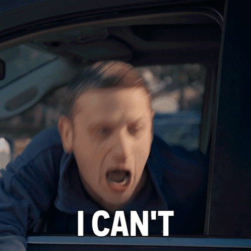 A Man In A Car With The Words " I Can 'T " On His Face GIF