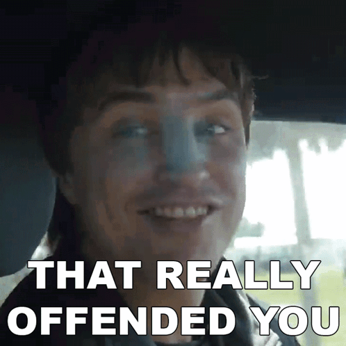 A Man In A Car With The Words That Really Offended You On The Bottom GIF