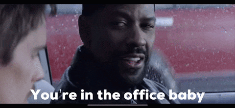 A Man In A Car With The Words You 'Re In The Office Baby On The Screen GIF