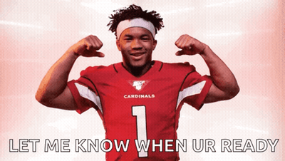 A Man In A Cardinals Jersey Flexing His Muscles GIF