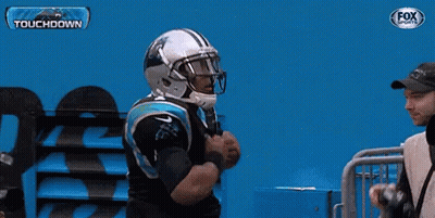 A Man In A Carolina Panthers Jersey Is Being Photographed By A Fox Sports Photographer GIF