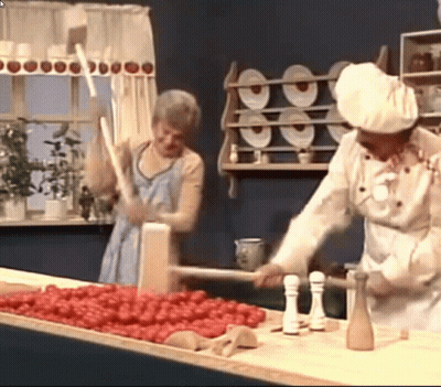 A Man In A Chef 'S Hat Is Standing Next To A Woman In A Kitchen GIF