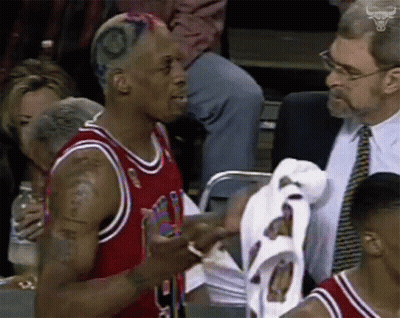 A Man In A Chicago Bulls Jersey Talking To Another Man GIF