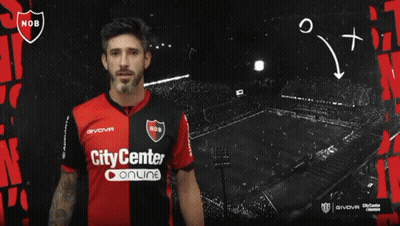 A Man In A City Center Online Jersey Stands In Front Of A Black Background GIF