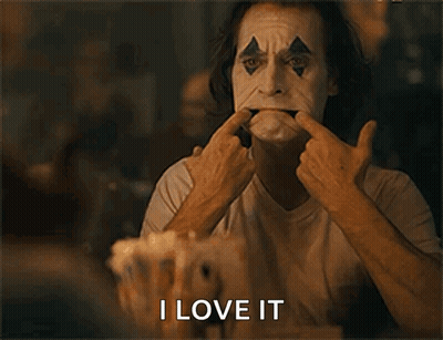 A Man In A Clown Mask Is Making A Funny Face And The Words I Love It Are Below Him GIF