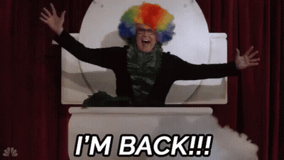 A Man In A Clown Wig Is Sitting In A Toilet With His Arms Outstretched And The Words I 'M Back GIF