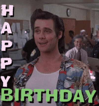 A Man In A Colorful Shirt Is Smiling With The Words Happy Birthday Behind Him GIF