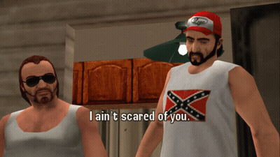 A Man In A Confederate Flag Tank Top Says I Ain T Scared Of You GIF