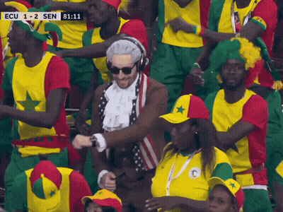 A Man In A Costume Is Dancing In A Crowd With Ecu 1-2 Sen Written On The Screen GIF