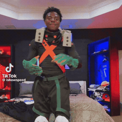A Man In A Costume Is Standing In Front Of A Bed With A Tiktok Logo On The Bottom Right GIF