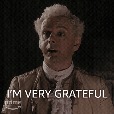 A Man In A Costume Says I 'M Very Grateful On A Screen GIF