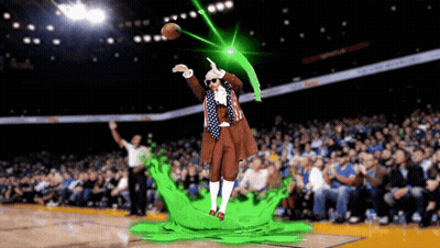 A Man In A Costume Throws A Basketball In A Stadium GIF