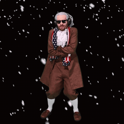 A Man In A Costume With An American Flag Around His Neck Is Standing In The Snow GIF
