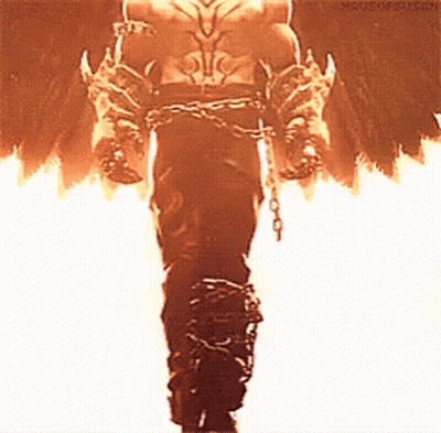 A Man In A Costume With Chains Around His Waist Is Standing In Front Of Flames . GIF