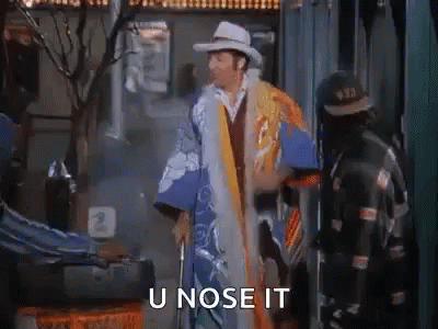 A Man In A Cowboy Hat And Kimono Is Standing Next To A Man With A Cane And Saying U Nose It . GIF