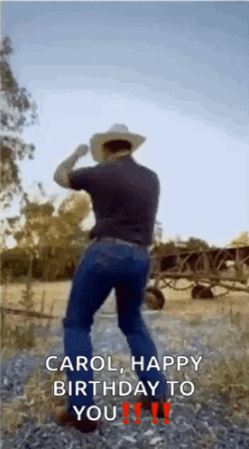 A Man In A Cowboy Hat Is Dancing In A Field And Says Carol Happy Birthday To You !! GIF