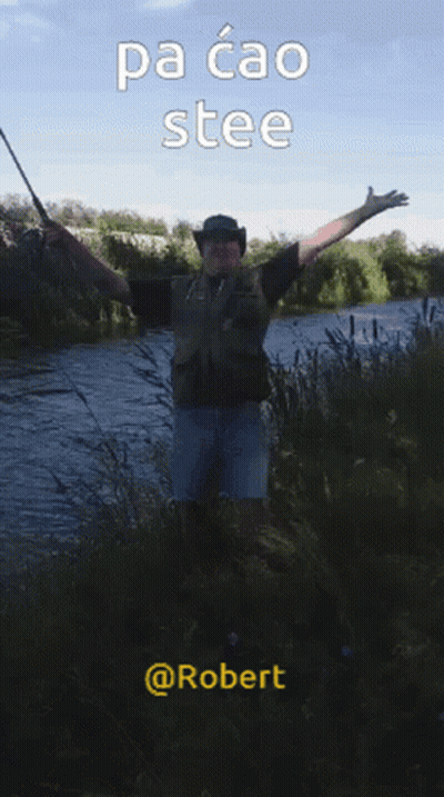 A Man In A Cowboy Hat Is Holding A Fishing Rod In Front Of A River With The Caption Pa Cao Stee GIF
