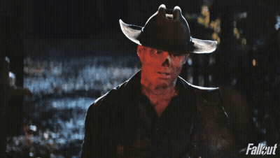 A Man In A Cowboy Hat Is Holding A Rifle With Fallout Written On The Bottom Right GIF