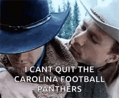 A Man In A Cowboy Hat Is Hugging Another Man In A Fur Coat . GIF