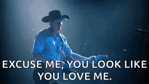 A Man In A Cowboy Hat Is Playing A Guitar And Says Excuse Me You Look Like You Love Me . GIF