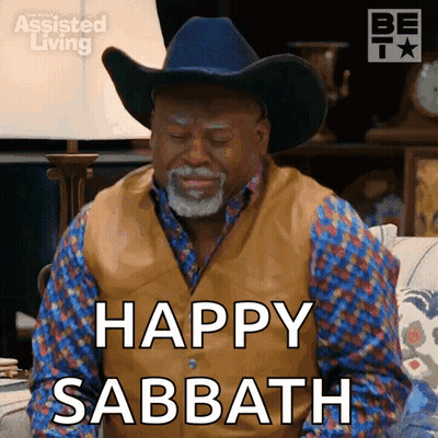 A Man In A Cowboy Hat Is Saying Happy Sabbath . GIF