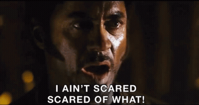 A Man In A Cowboy Hat Is Saying I Ain 'T Scared Scared Of What GIF