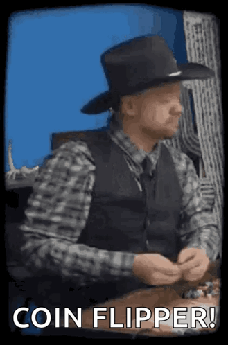 A Man In A Cowboy Hat Is Sitting At A Table With The Words Coin Flipper Written On The Bottom . GIF