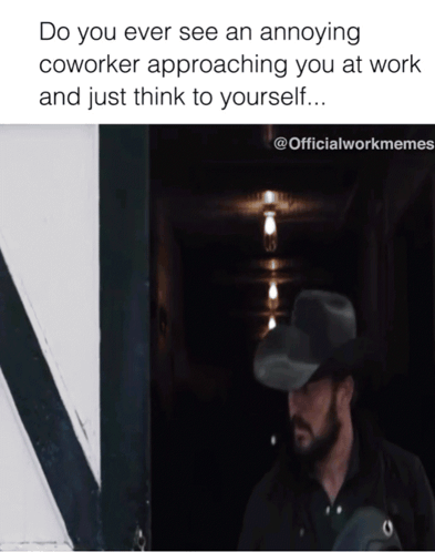 A Man In A Cowboy Hat Is Standing In A Dark Hallway With A Caption That Says Do You Ever See An Annoying Coworker GIF