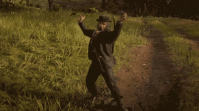 A Man In A Cowboy Hat Is Standing In A Field GIF