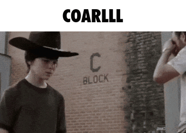 A Man In A Cowboy Hat Is Standing In Front Of A Brick Wall With The Word C Block Written On It GIF