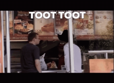 A Man In A Cowboy Hat Is Standing In Front Of A Fast Food Restaurant And Says Toot Toot GIF